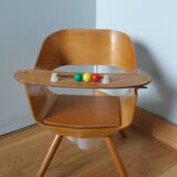 Baumann Baby Coquille children's armchair in bent wood with splayed legs.