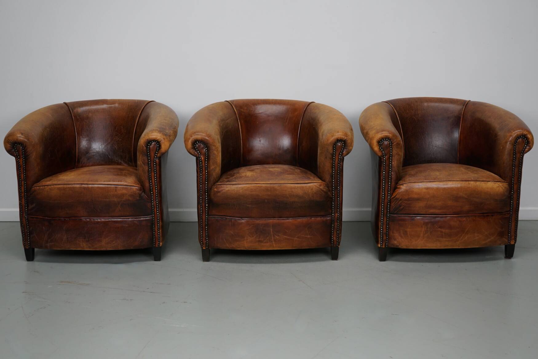Fauteuils club vintage hollandais en cuir cognac, lot de trois