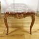 Table basse de style Louis XV en bois doré dessus marbre