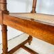 Antique banquette in Louis XIII style, turned wood with caning, late 19th to early 20th century.