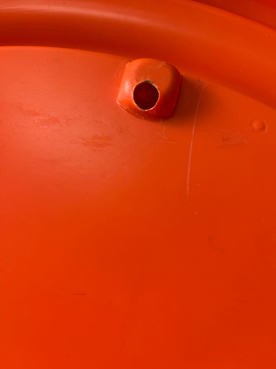 Mirror with round frame in orange molded plastic by carrara & matta, 1974