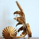 Applies "wheat sheaf" gold metal
