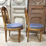 Paire de chaises style Louis XVI en bois doré