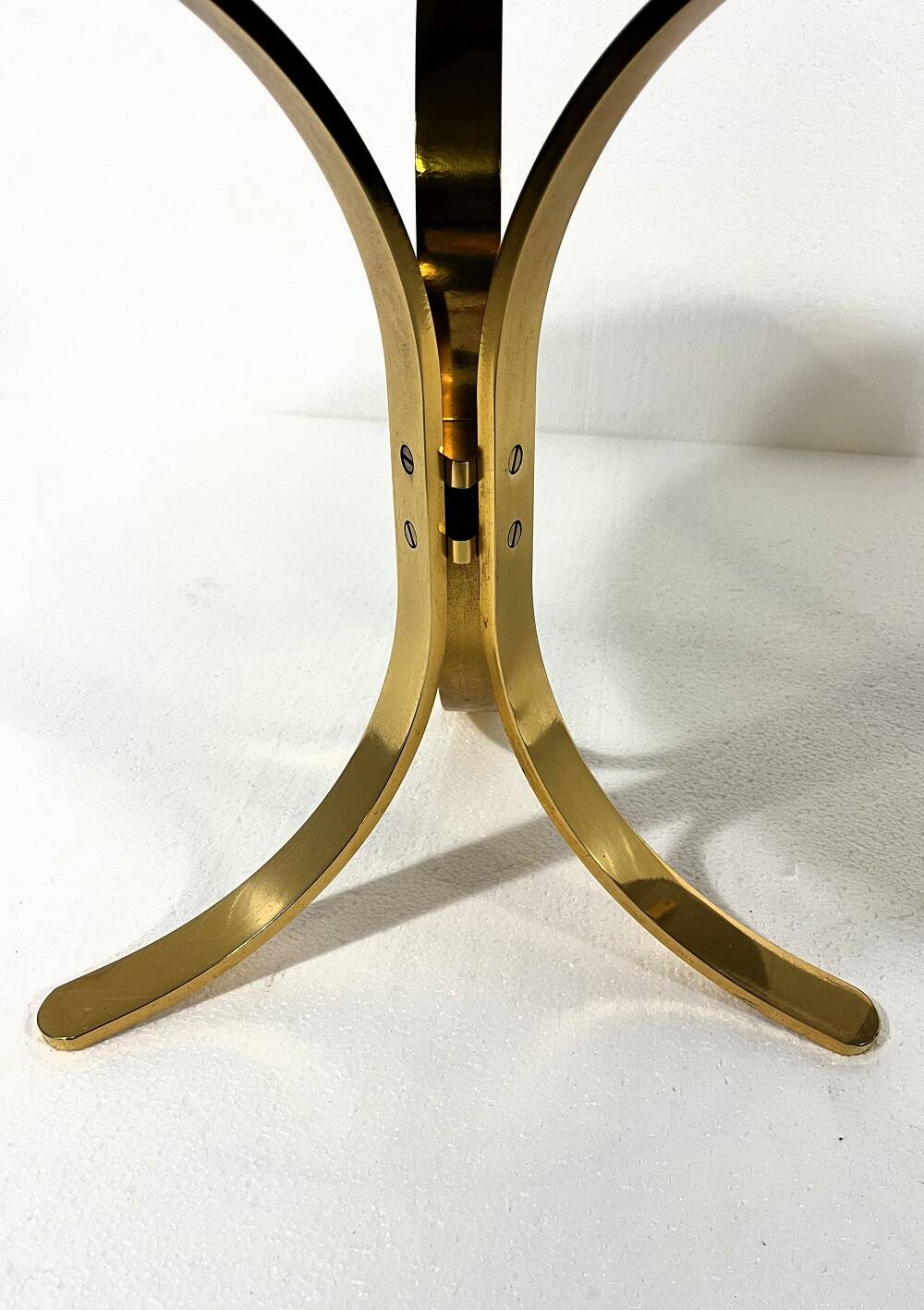 Brass and smoked glass side tables from the 1960s.