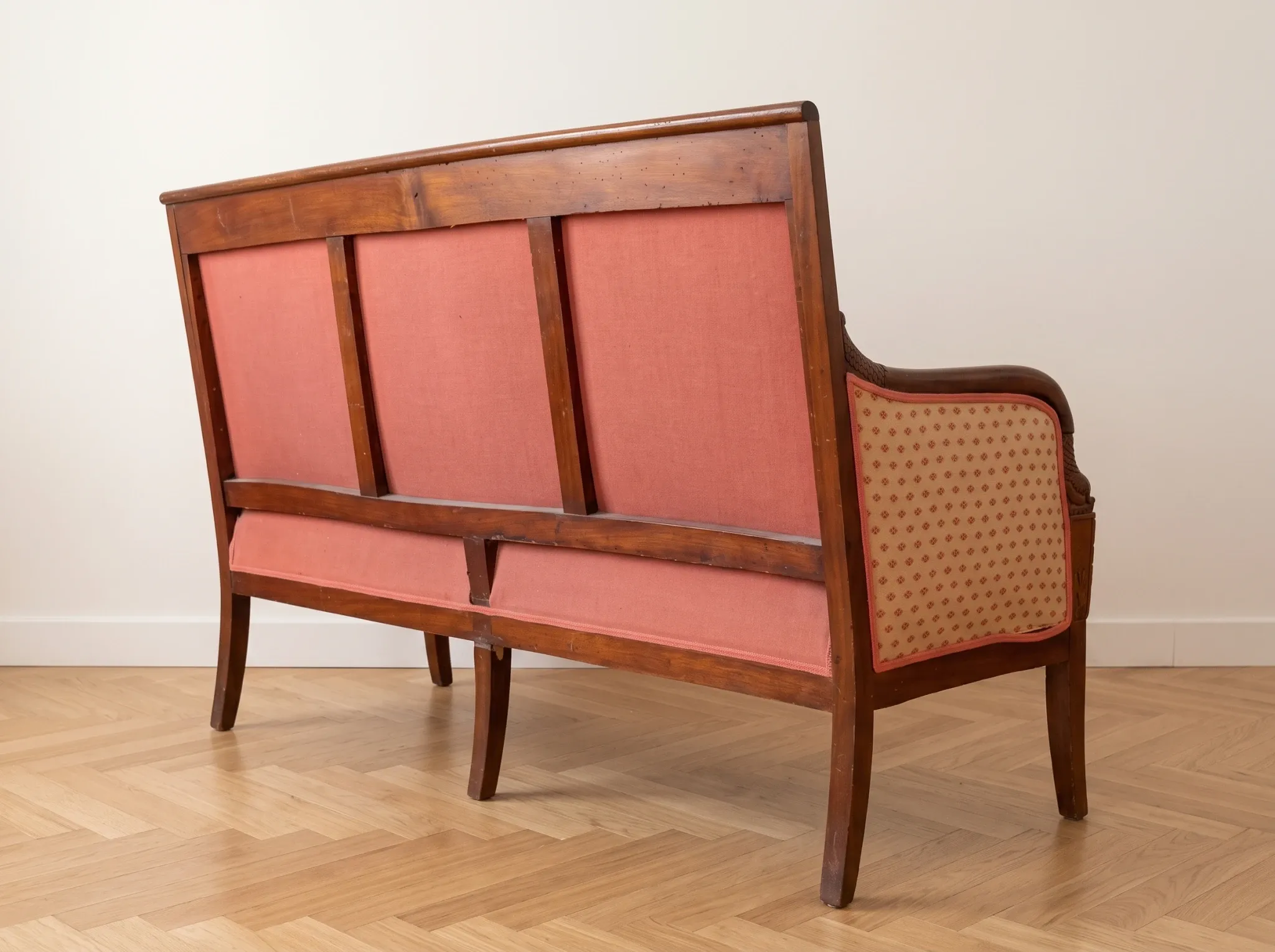 Restoration Empire period canapé bench in carved mahogany.