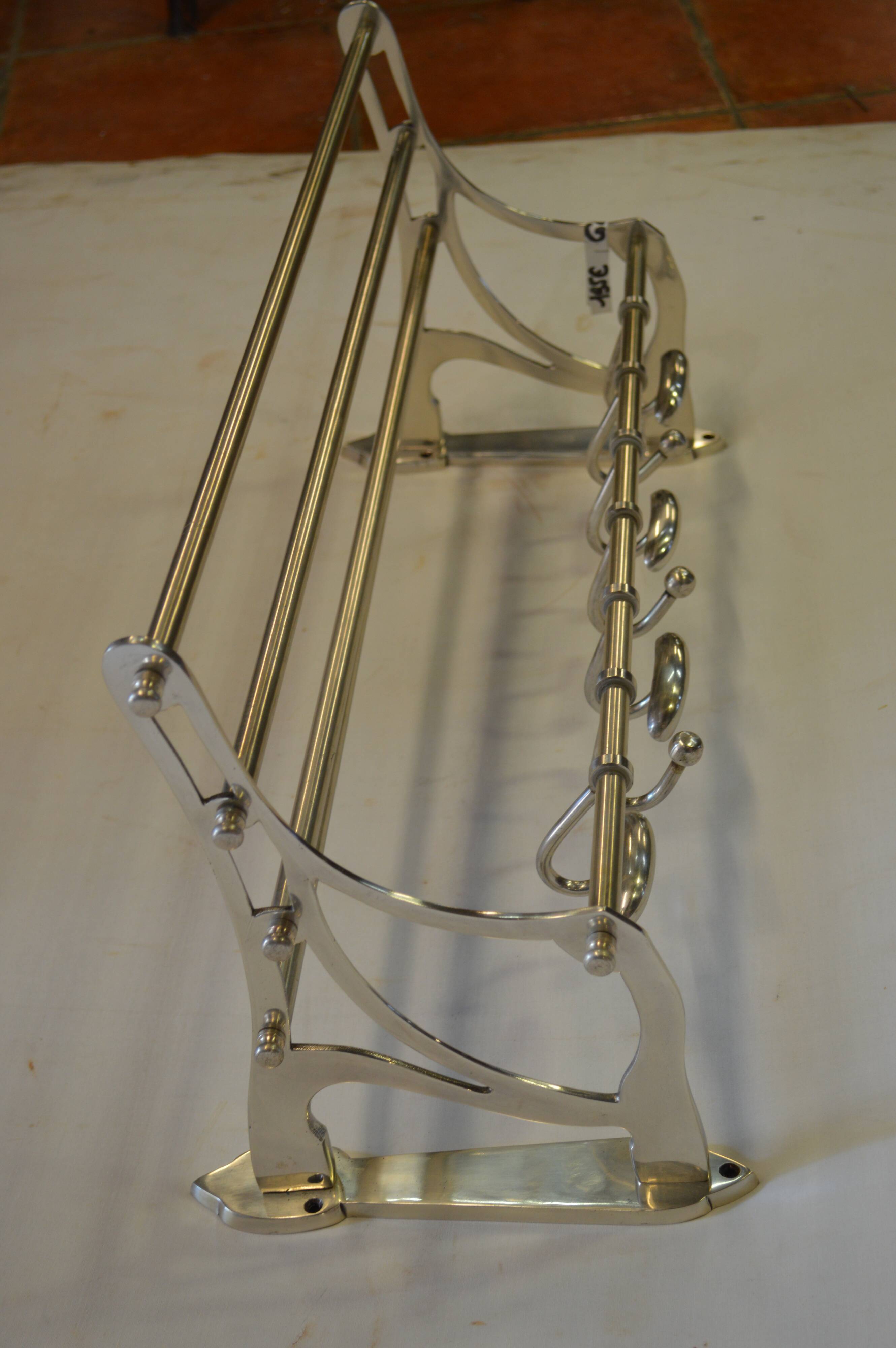 Chrome iron coat holder with a hat holder
