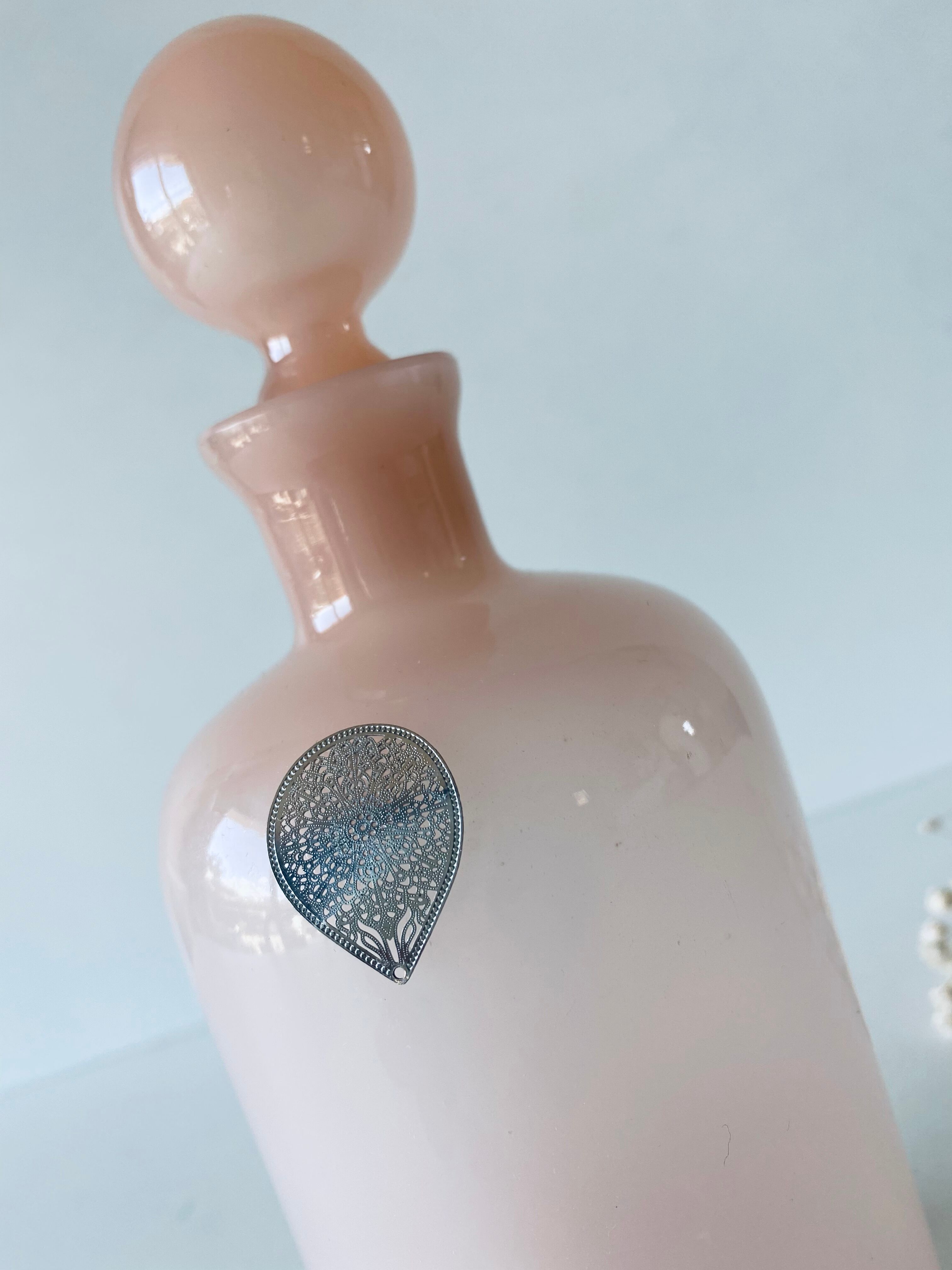 Powder pink opaline flask