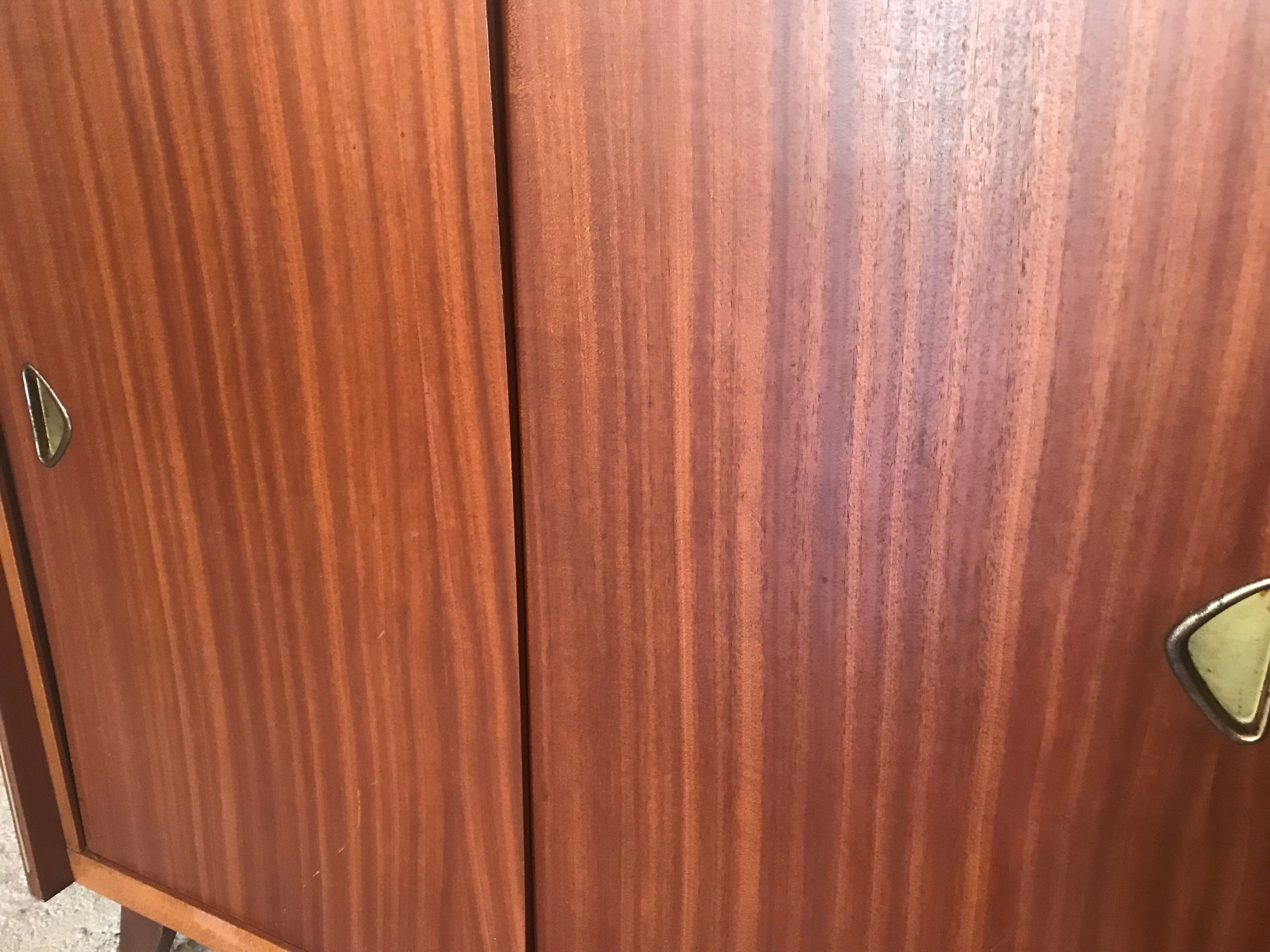 Vintage storage cabinet teak veneer sliding door compass feet