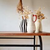 Metal tubular base table with a wooden top.