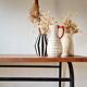 Metal tubular leg table with a wooden top.