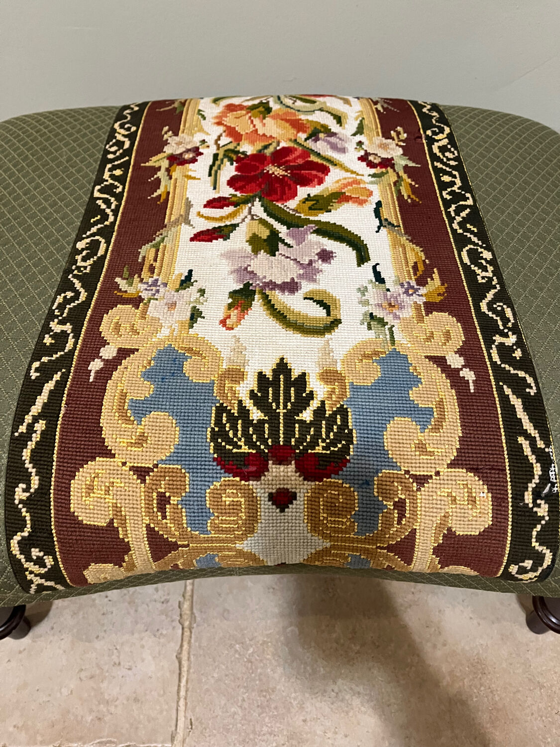 Vintage upholstered footstool, floral decor in Aubusson style.