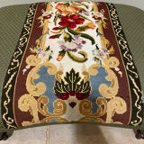 Vintage upholstered footstool, floral decor in Aubusson style.