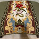 Vintage upholstered footstool, floral decor in Aubusson style.