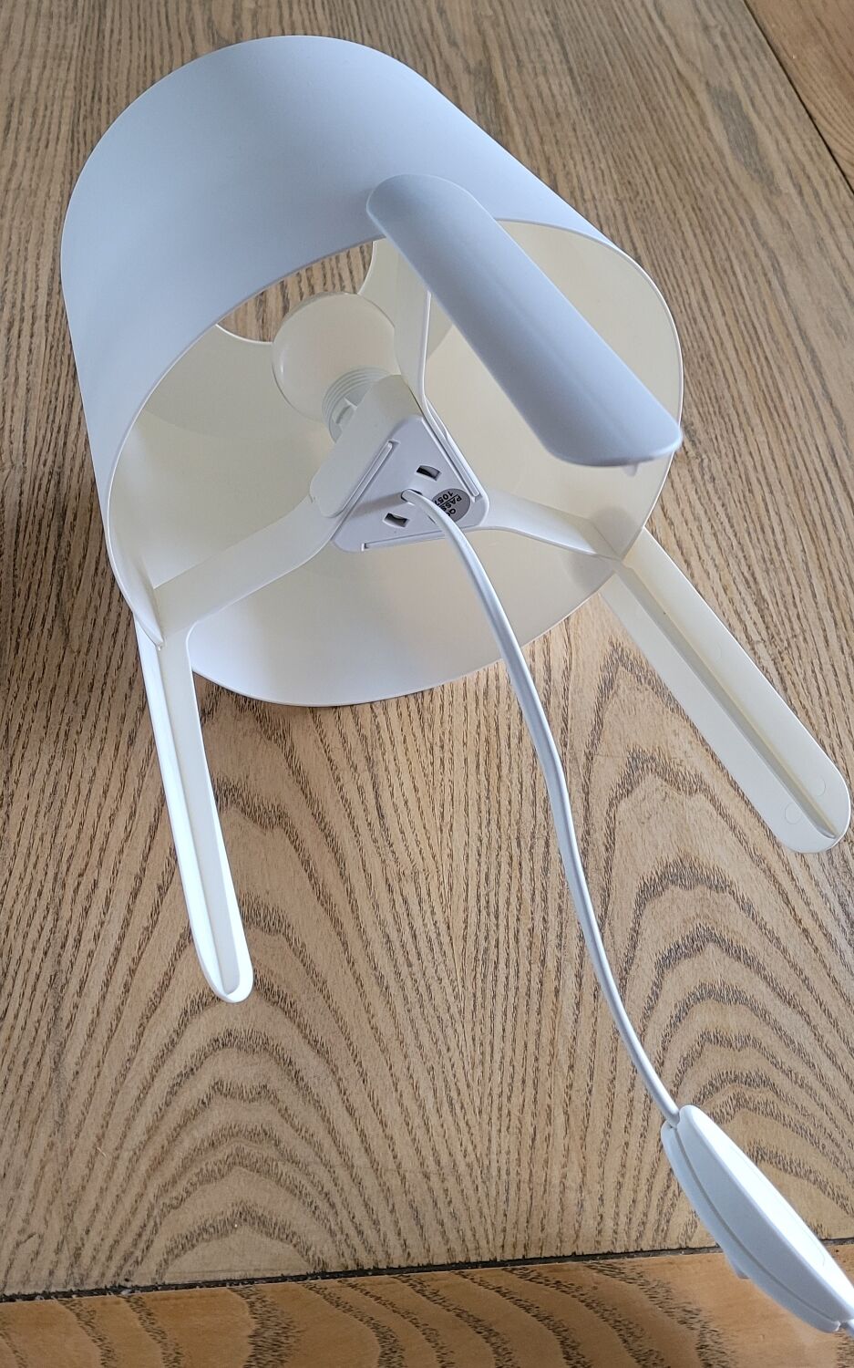 Pair of white Ikea Tvärs bedside lamps