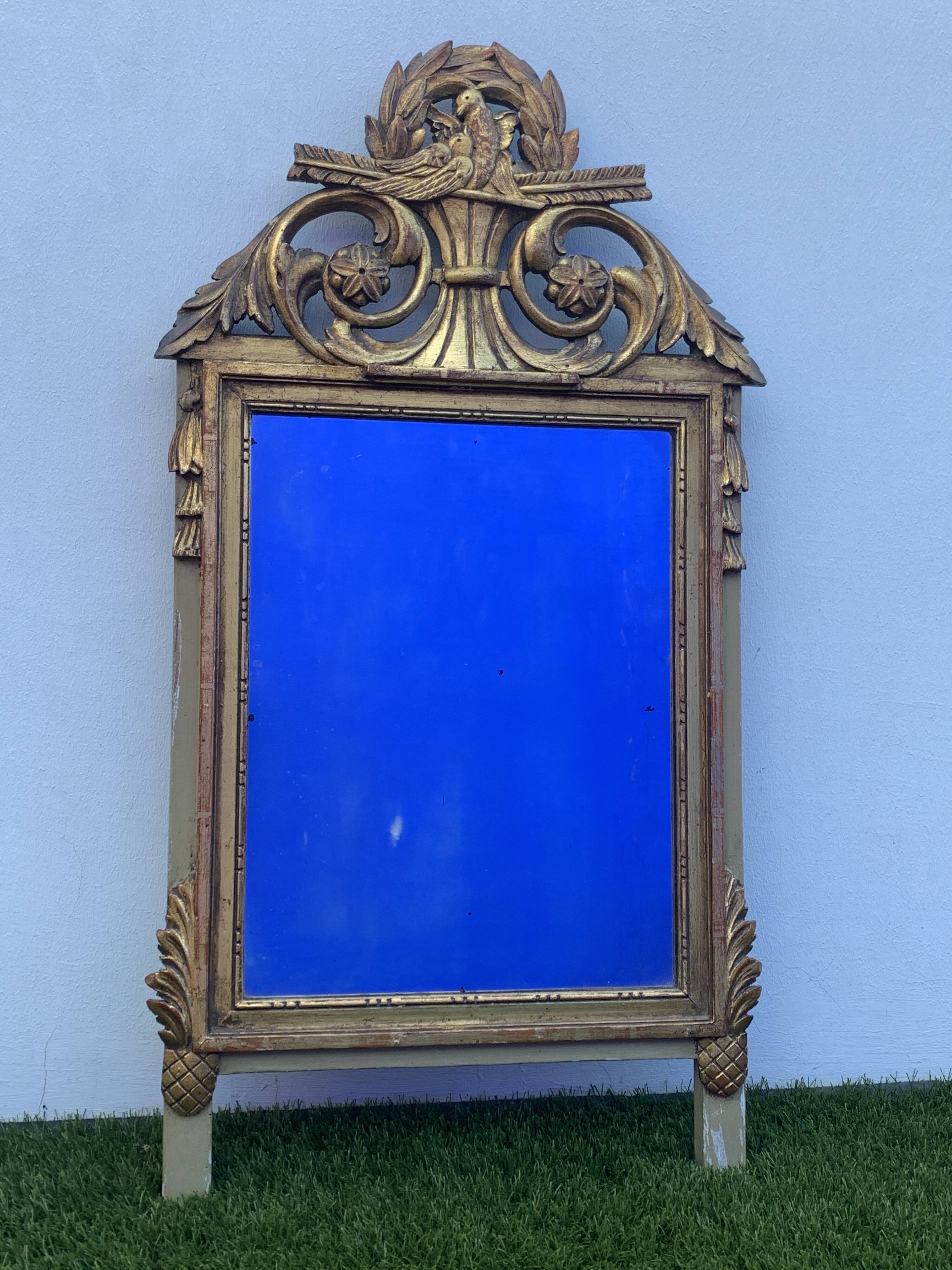 Antique mirror with gilded wood pediment, Louis XVI style