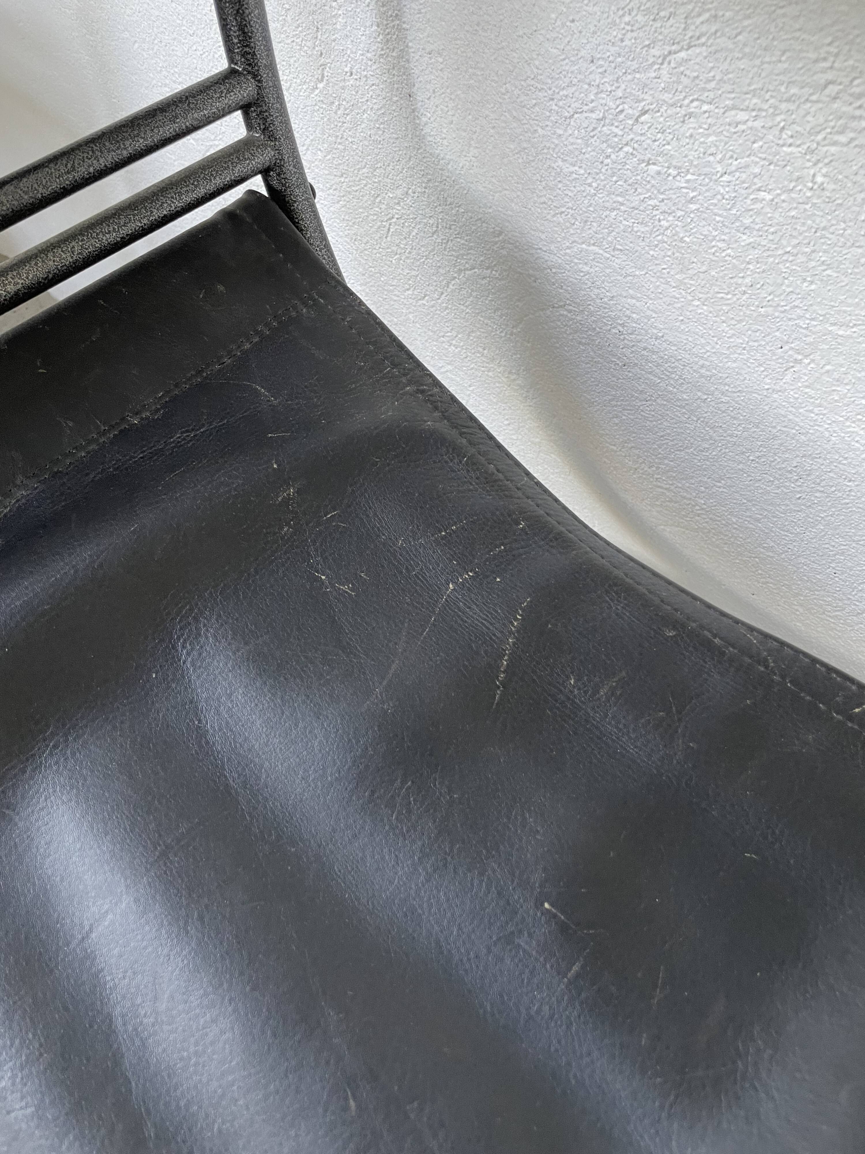 Pair of leather “curule” emperor armchairs