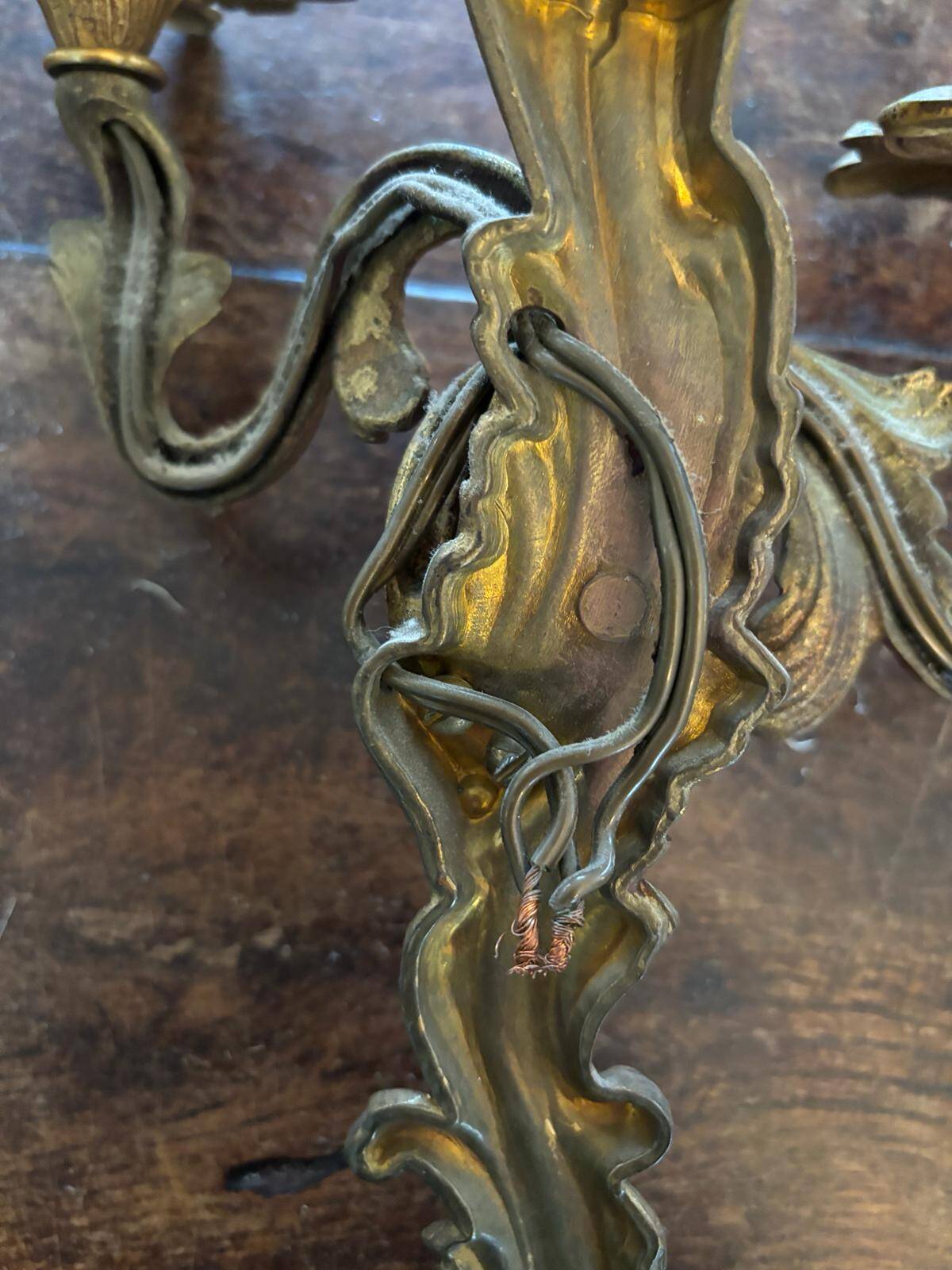 Pair of Louis XV Style wall lights in gilded bronze