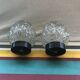 Old pair of glass moulded wall sconces with vintage black metal support