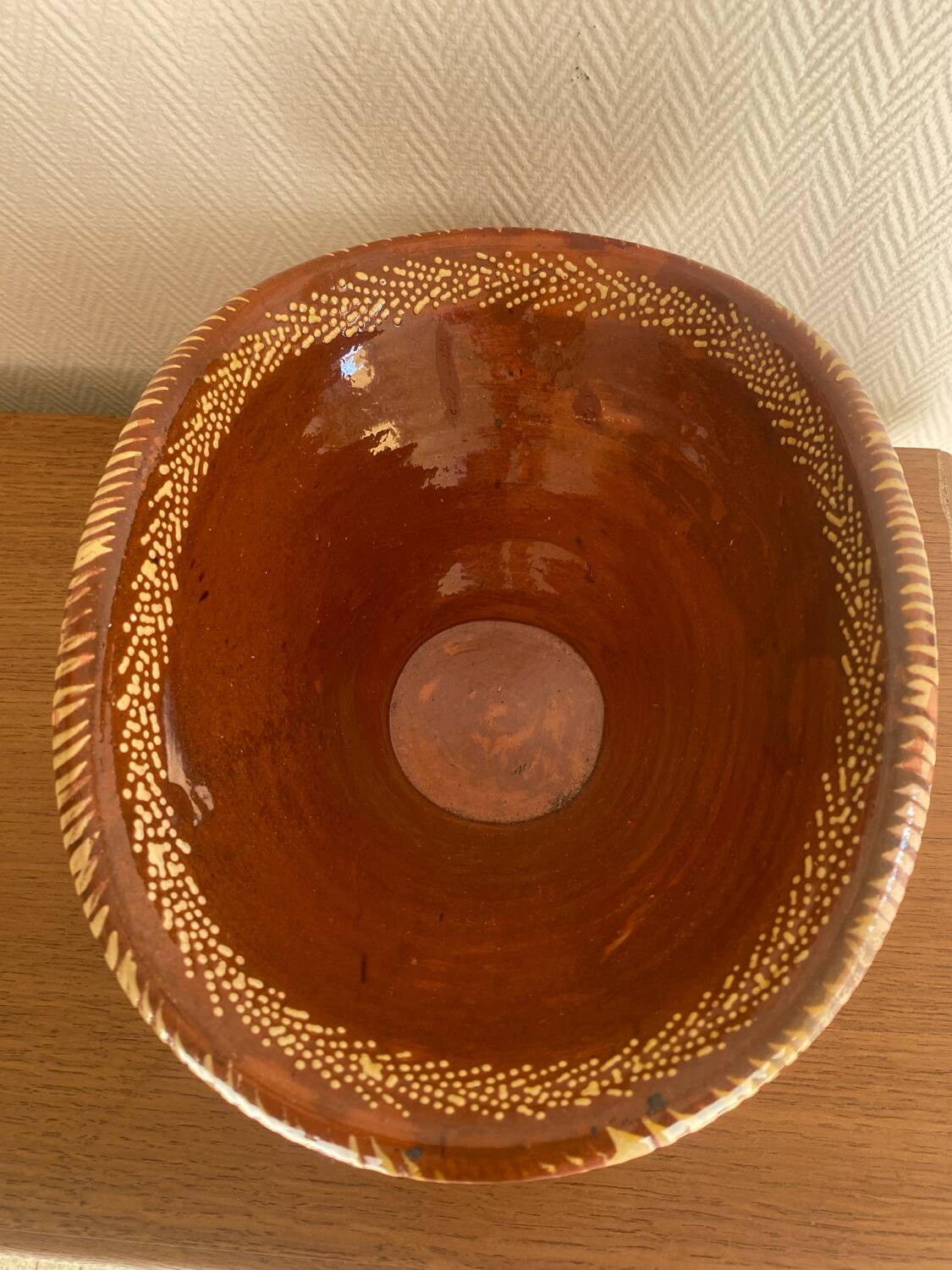 Old glazed terracotta plate, Portuguese craftsmanship.