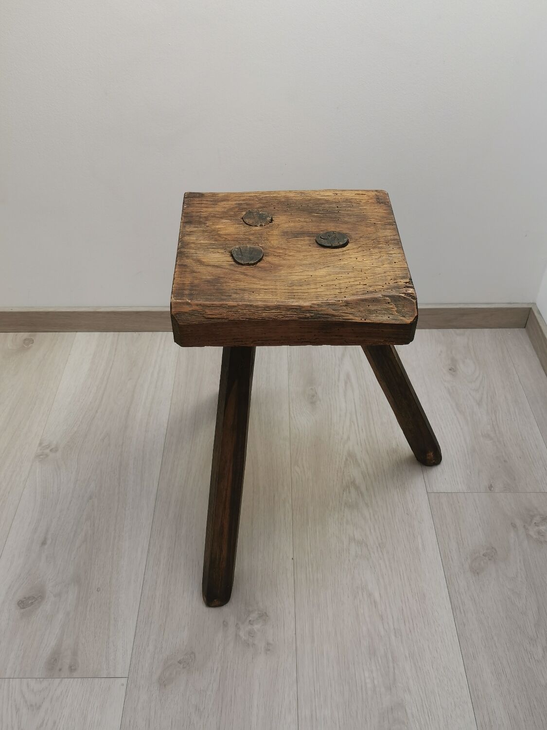 Old wooden stool tripods