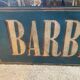 Barberia painted sheet metal sign