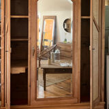 Large antique wardrobe made of solid raw wood and natural caning.