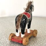 Old wooden pull-along toy, horse.