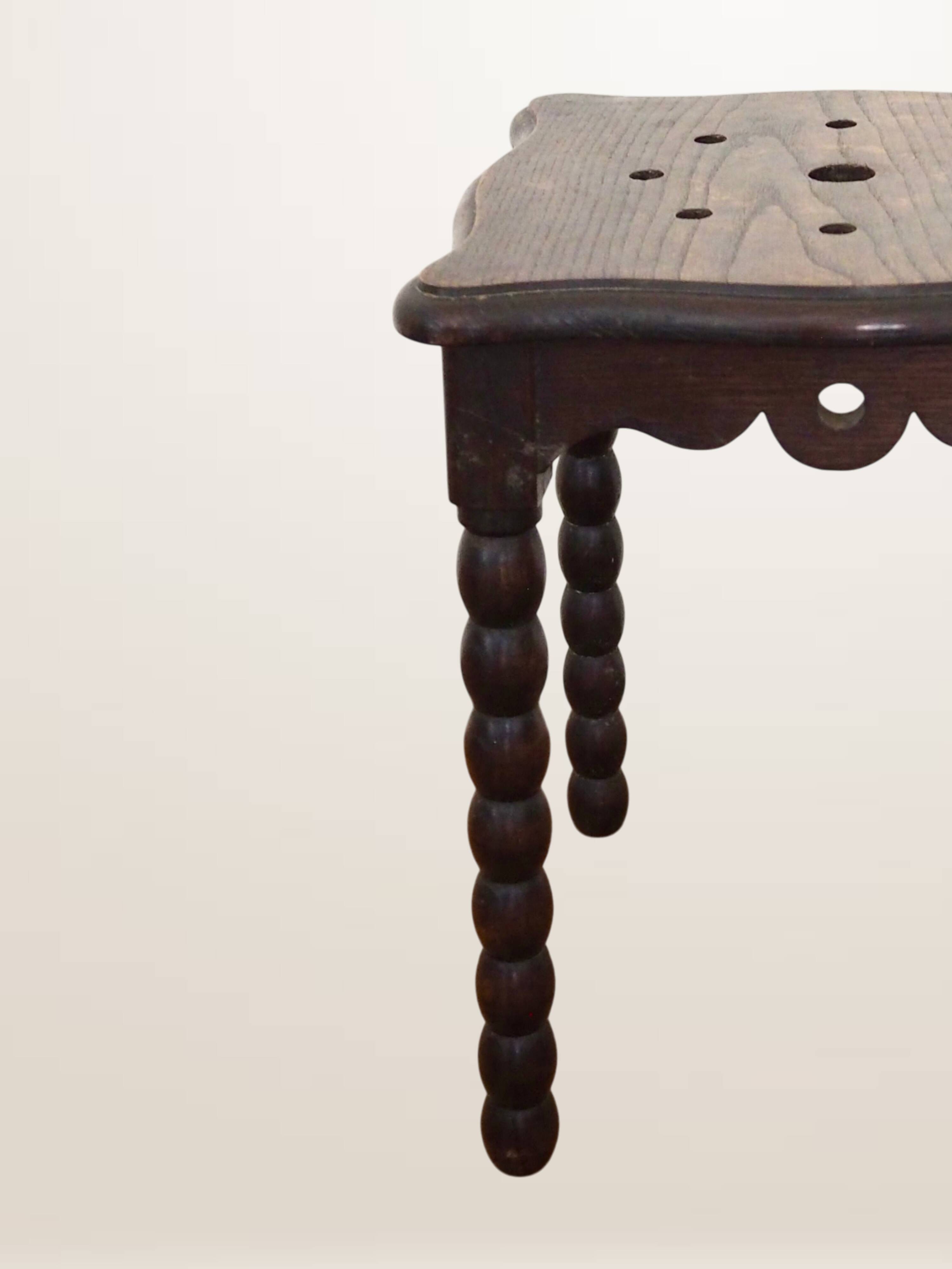 Oak stool with beaded spool legs