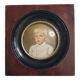 Miniature portrait of a young boy signed, wooden frame with convex glass, 12x12 cm.