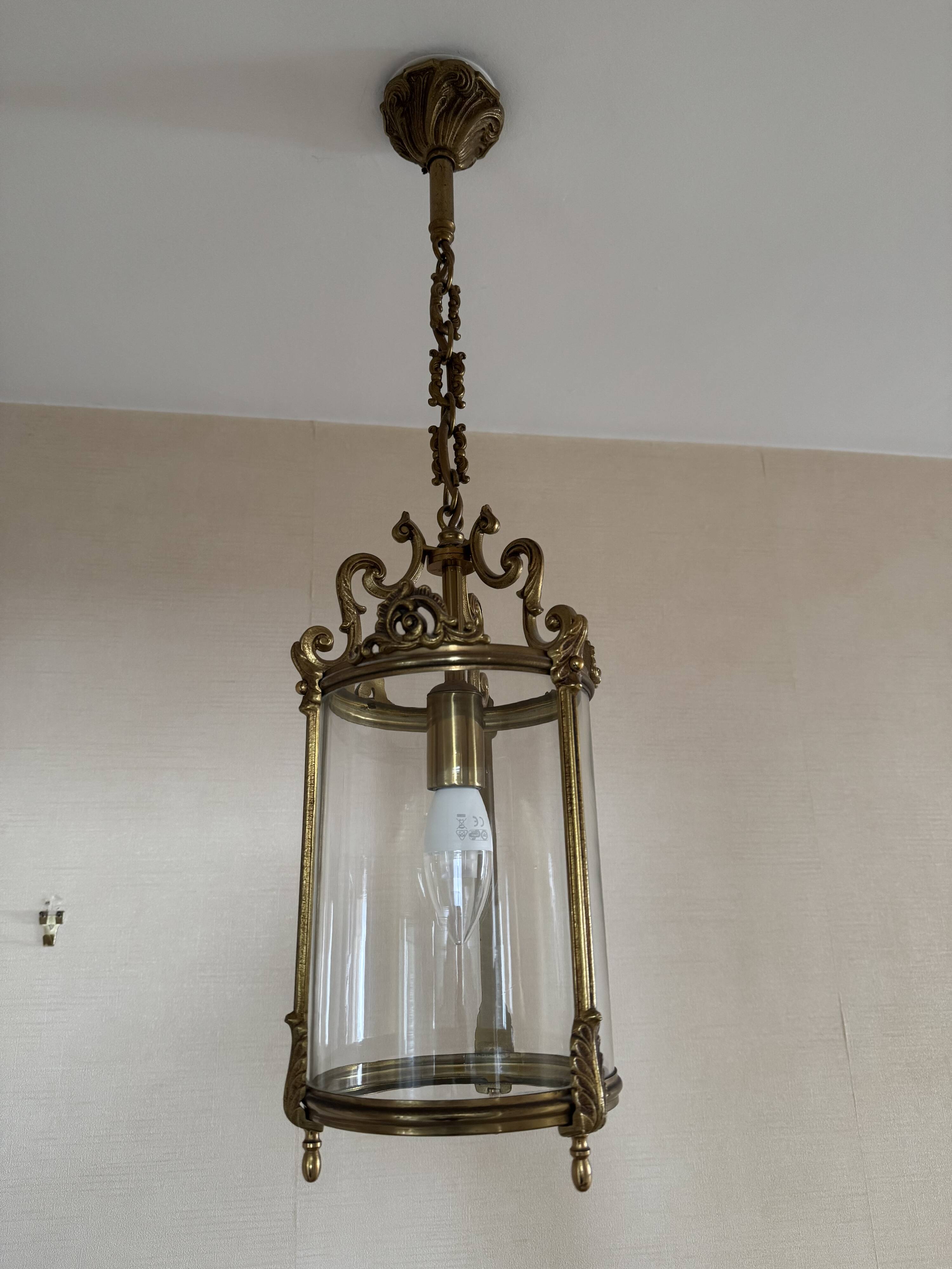 Golden hanging lantern and glass