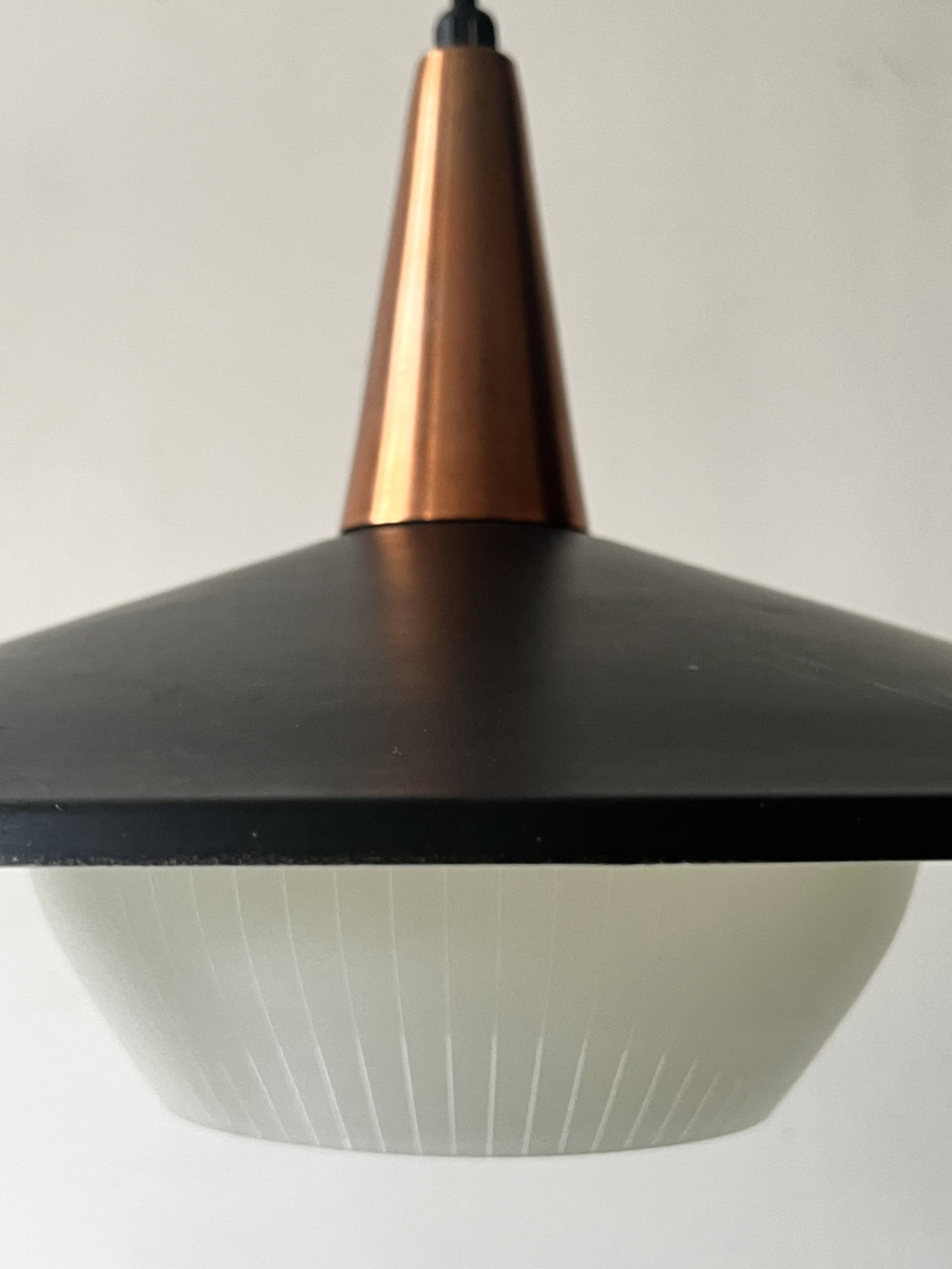 Scandinavian suspension in black metal, copper, and opal glass, 1970s design.
