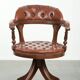 Swivel cowhide English style chesterfield office chair in a brown colour