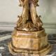 Alabaster bowl decorated with vine leaves on a base of three dolphins, circa 1880.