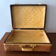 Vintage braided wicker suitcase