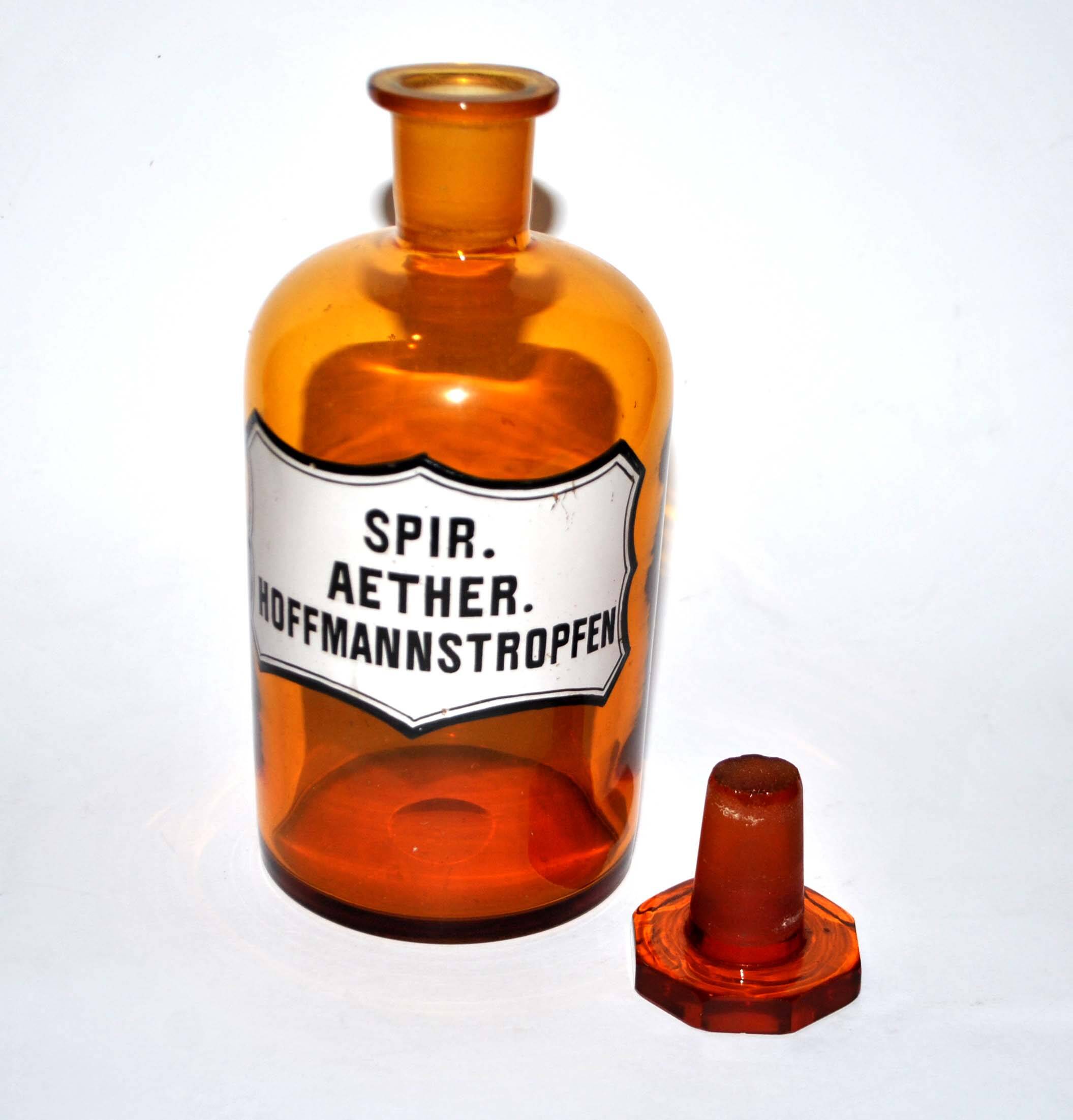 Old apothecary bottle Glass pharmacy bottle with enameled label