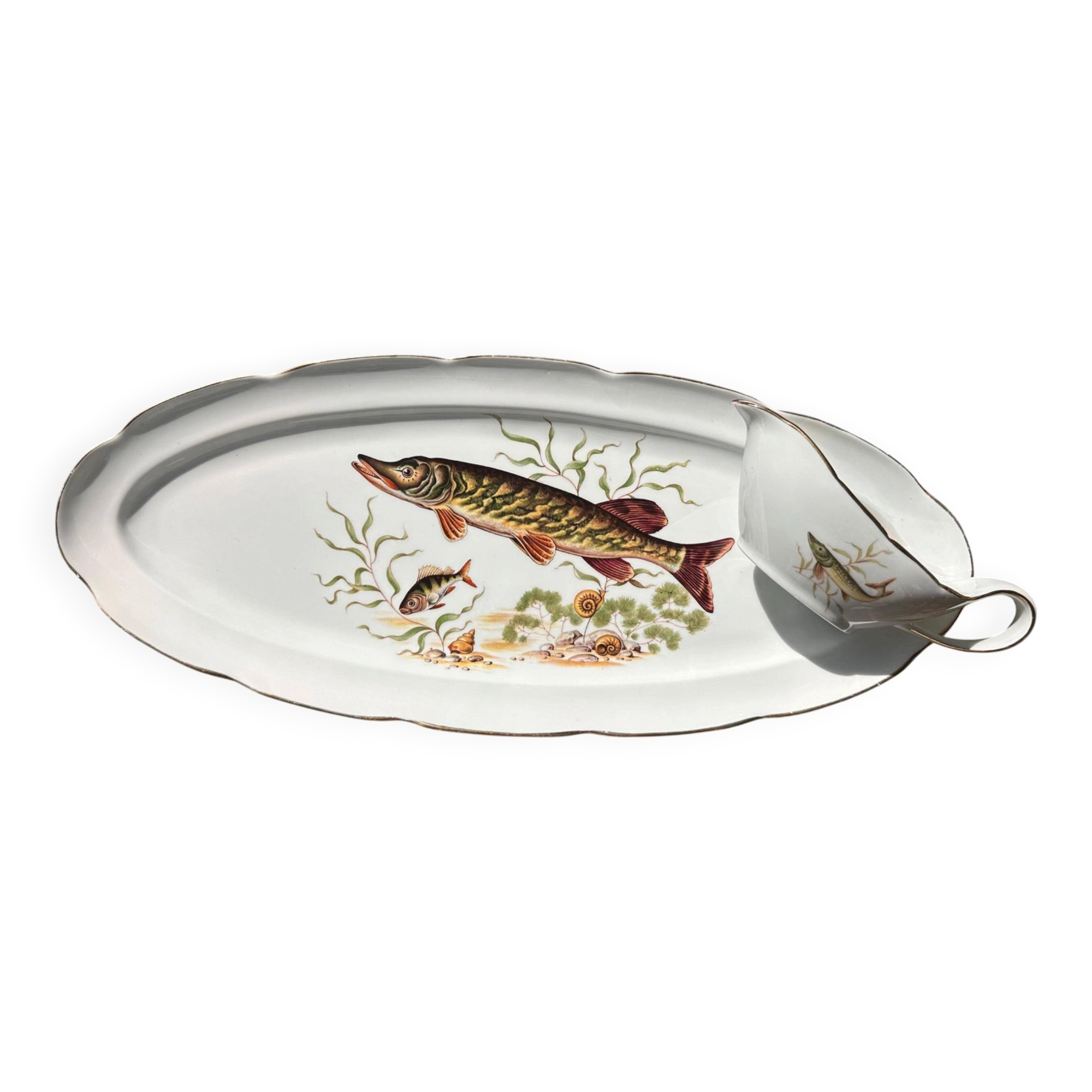 Large fish platter and its vintage porcelain sauce boat, decorated with pike.