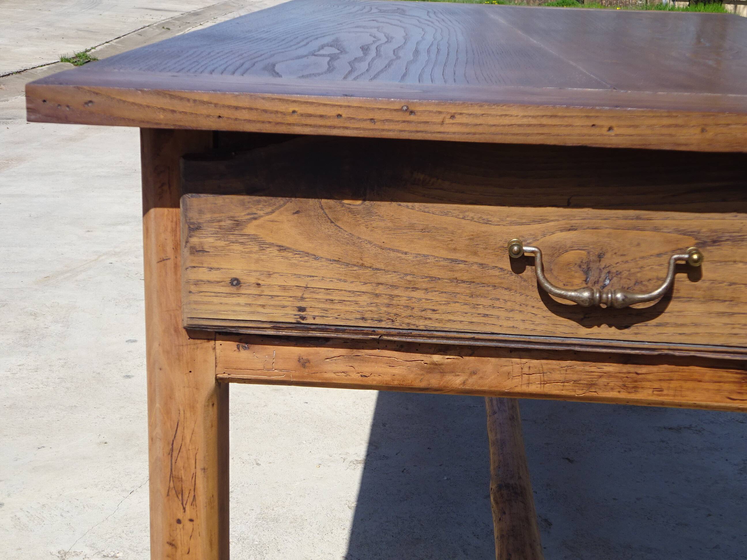 Old farmhouse table made entirely of restored solid oak.