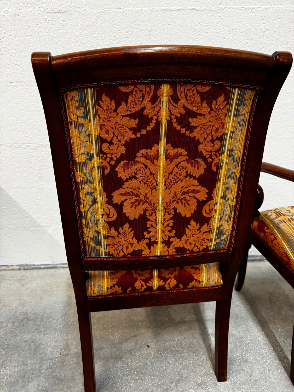 Pair of cross-back armchairs, Empire style, 19th century.