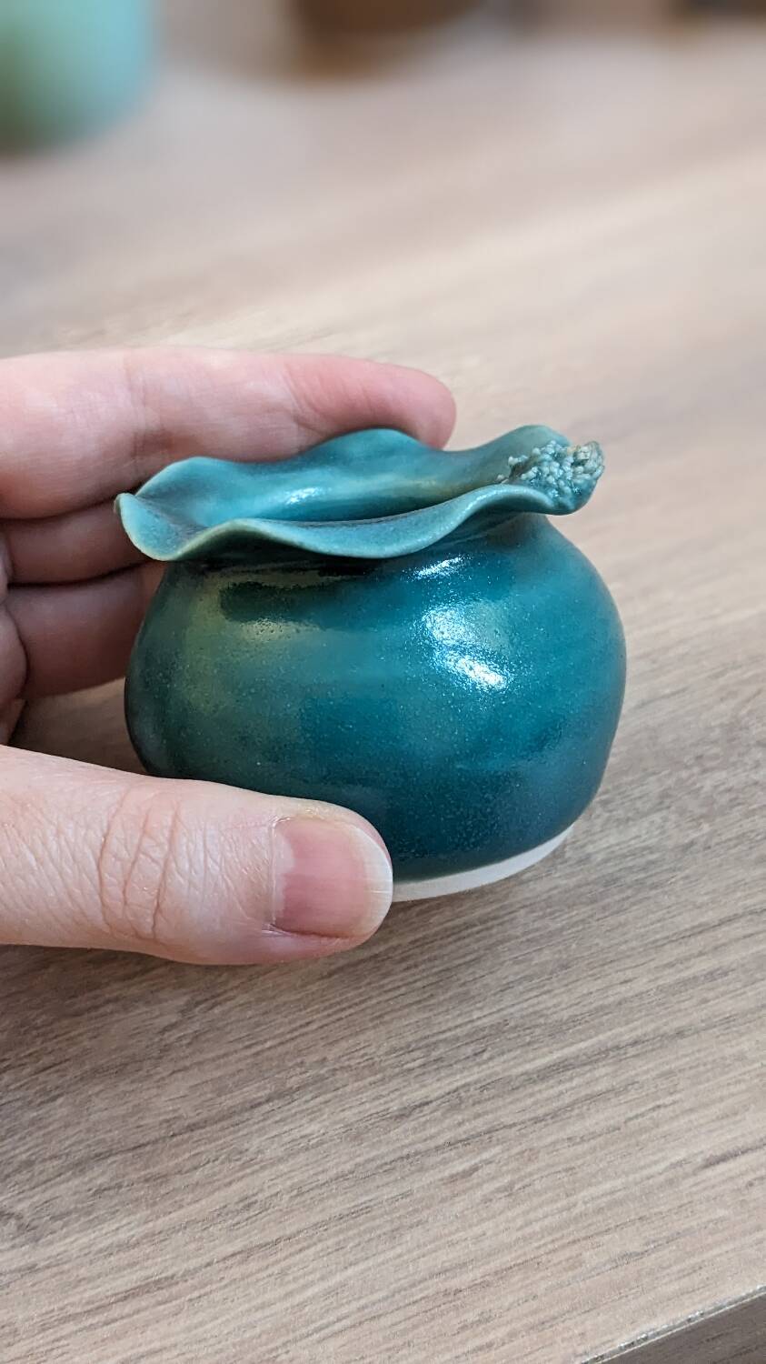 Small handmade turquoise pottery.