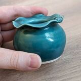 Small handmade turquoise pottery.