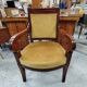 Armchair with scroll arms and sabre legs in mustard velvet, 19th century.