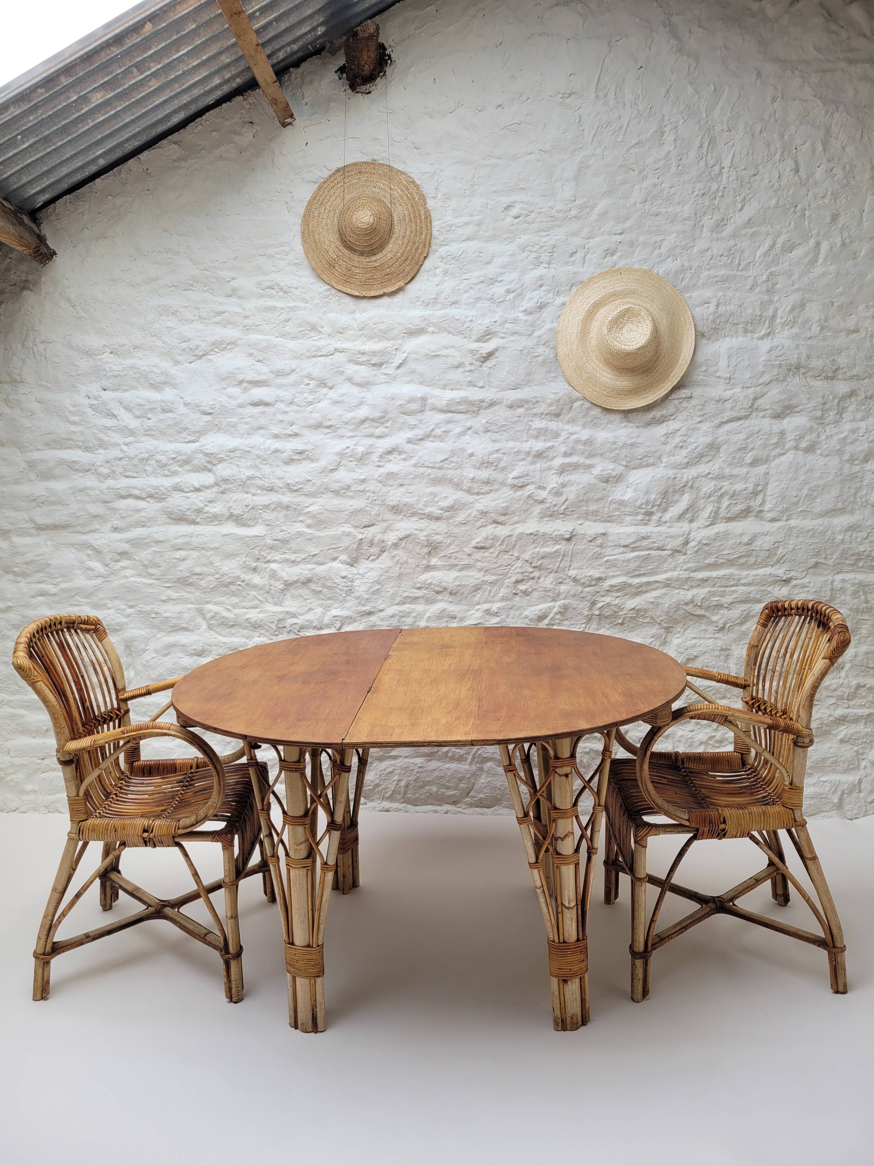 Vintage Audoux Minet bamboo, rattan, and smoked glass table duo.