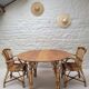 Vintage Audoux Minet bamboo, rattan, and smoked glass table duo.