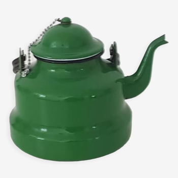 Old green kettle in enamelled metal