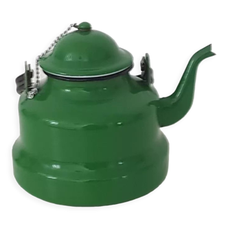 Old green kettle in enamelled metal