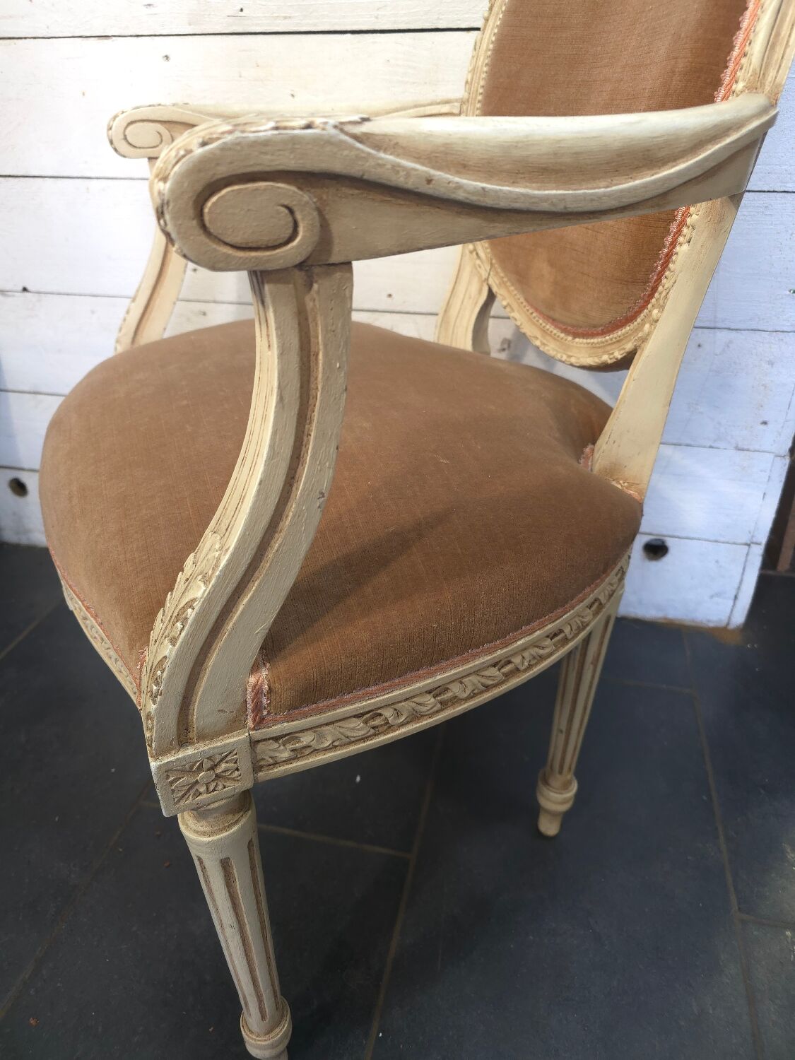 Louis XVI style bergère armchair in patinated wood