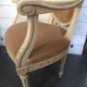 Louis XVI style bergère armchair in patinated wood