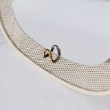 Luminous mirror in perforated sheet metal and brass