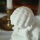 Limestone bust young girl who reads