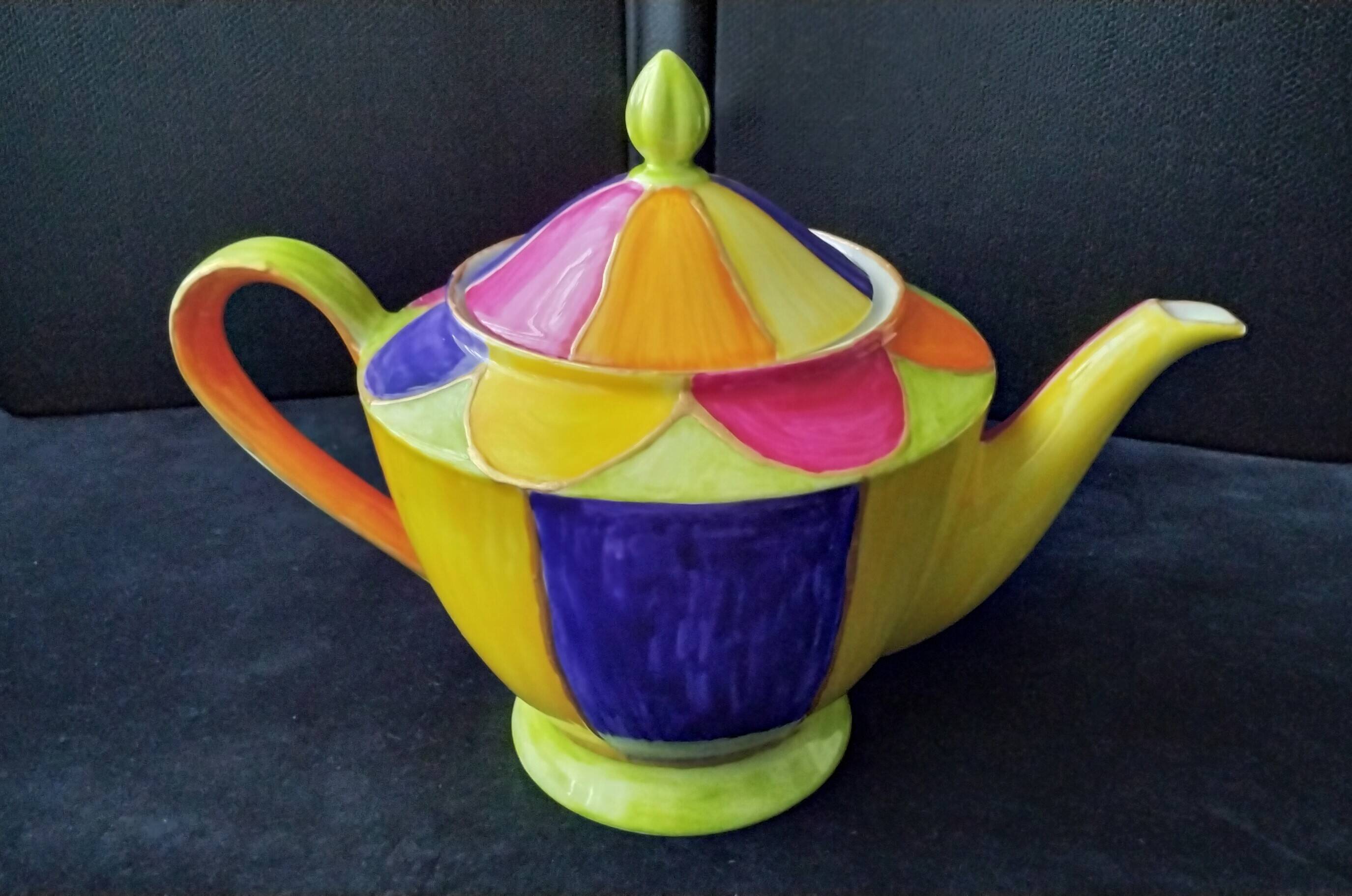Polychrome porcelain teapot hand-painted.